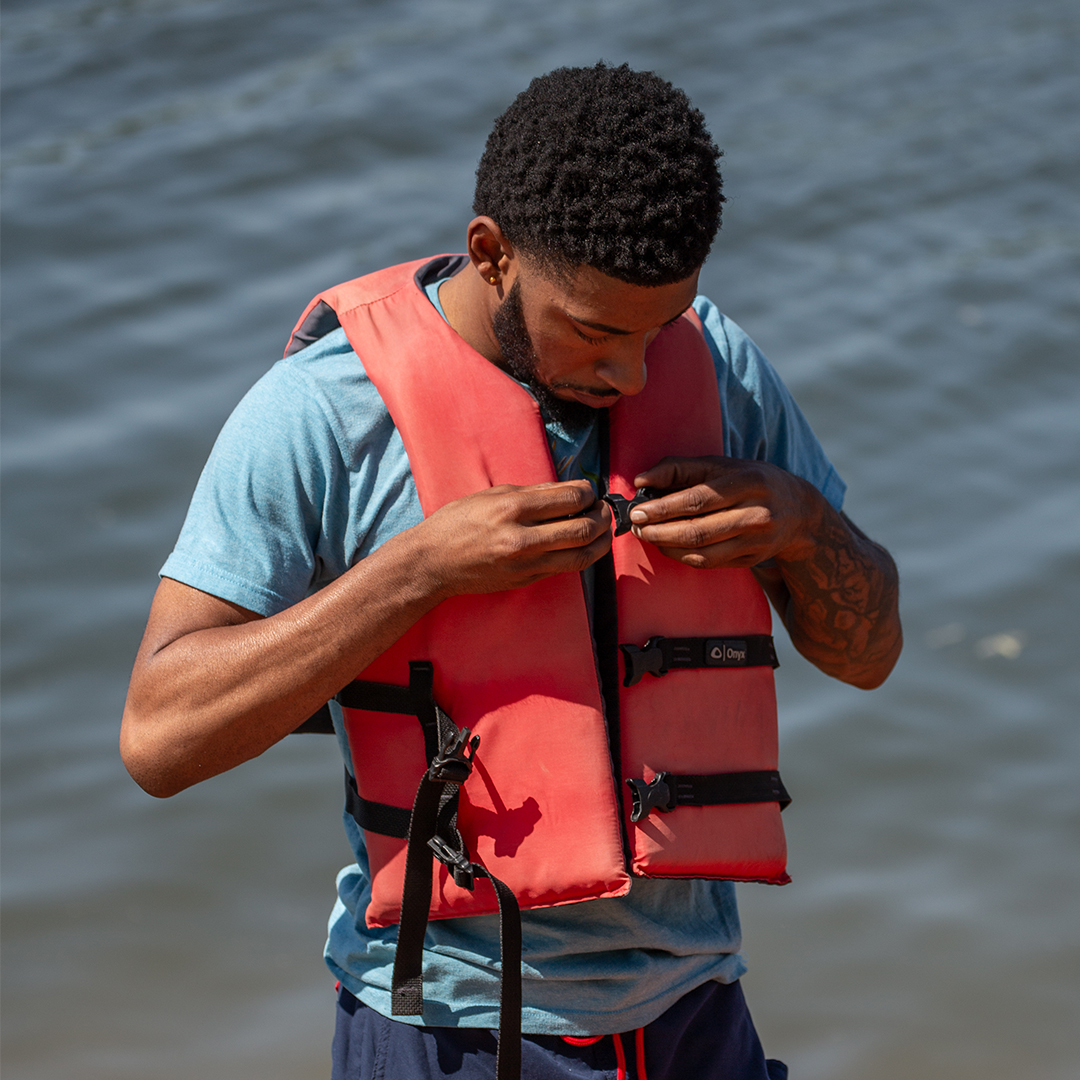 Person putting on a life Jacket